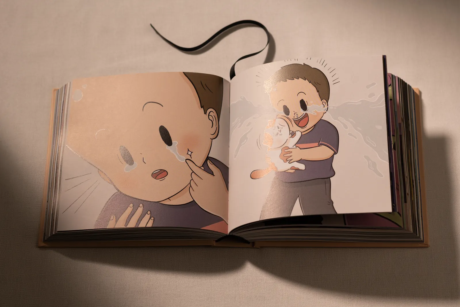 Open spread: a boy wipes away tears, then hugs a cat and cries with joy